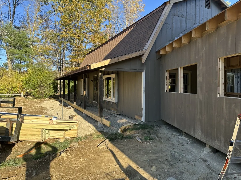 Pine siding going onto the barn in autumn