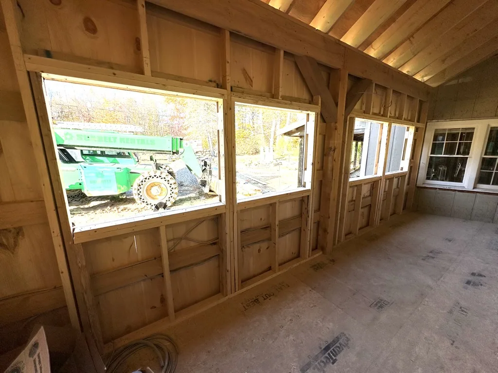 Interior with a window opening and timber framing