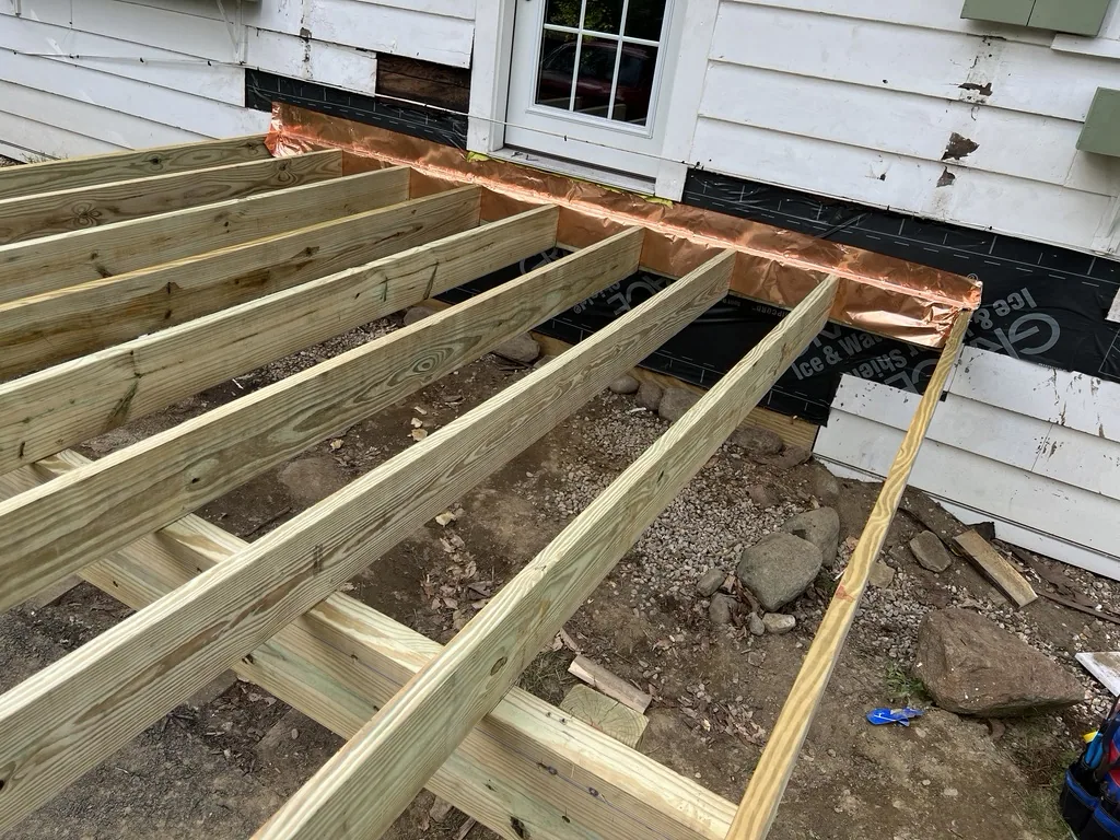 New framing and joists going in over precast footings