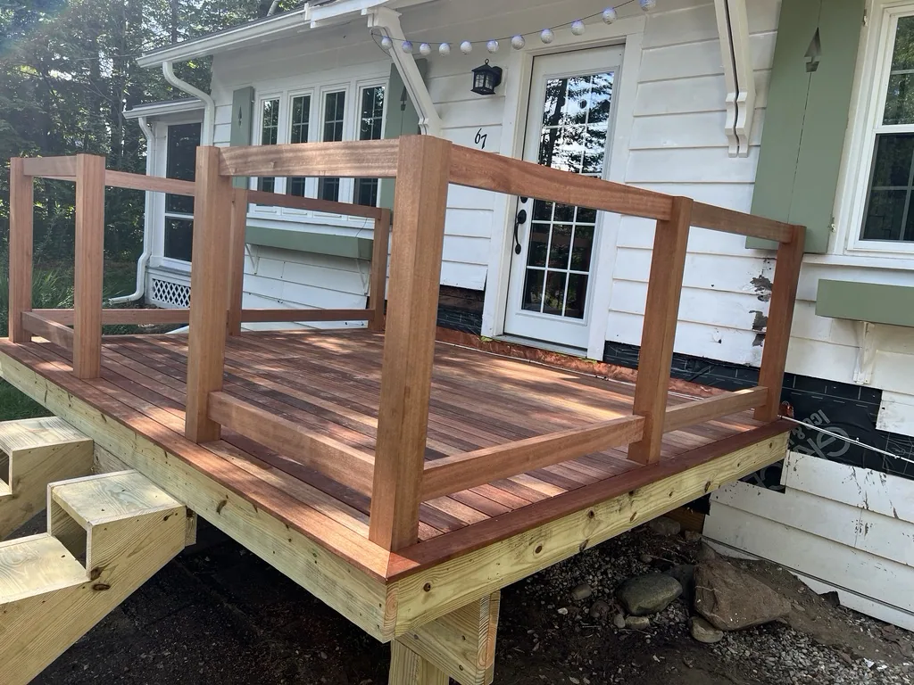 Mahogany deck boards installed with railing
