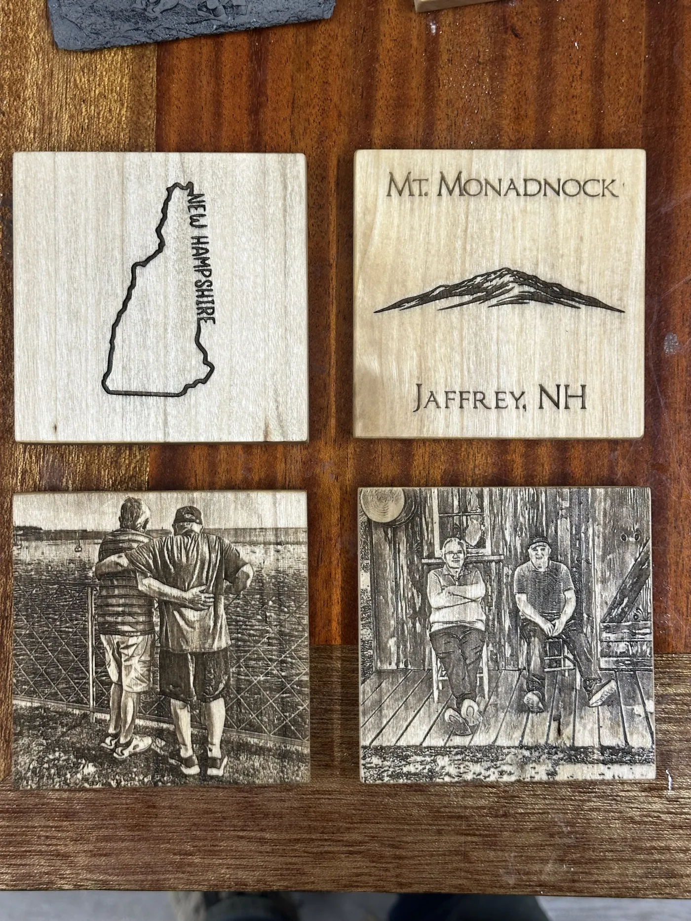Mixed coaster set pairing engraved scenes with custom black-and-white photographs.