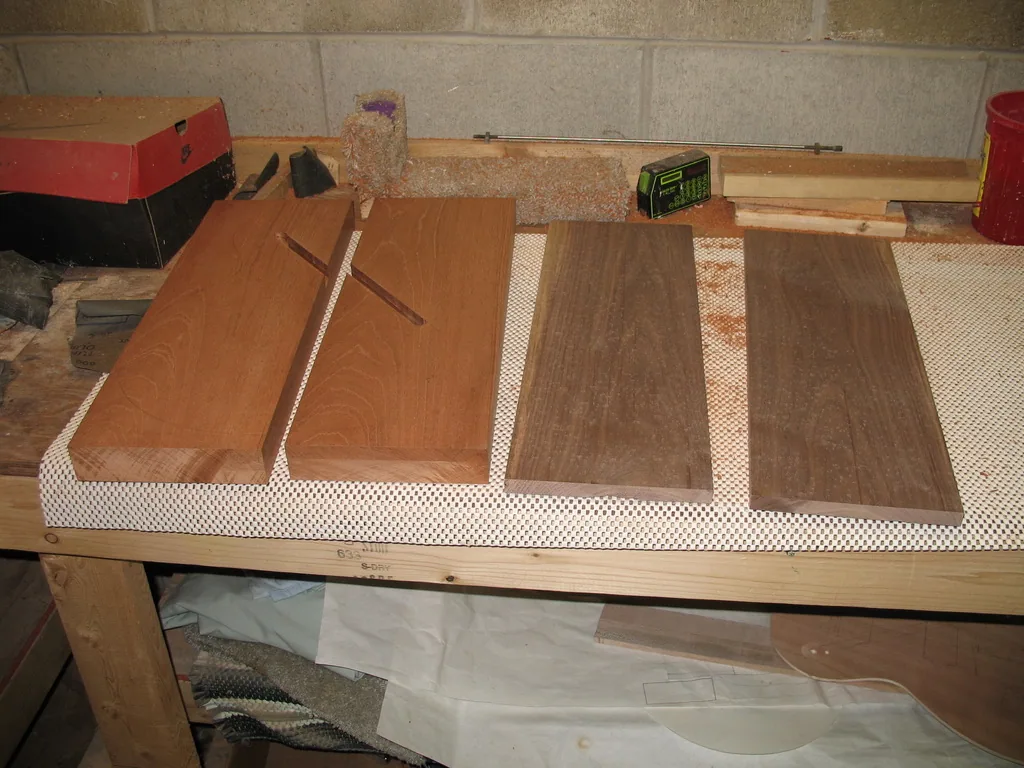 Rough mahogany and black walnut blanks for the guitar body and top