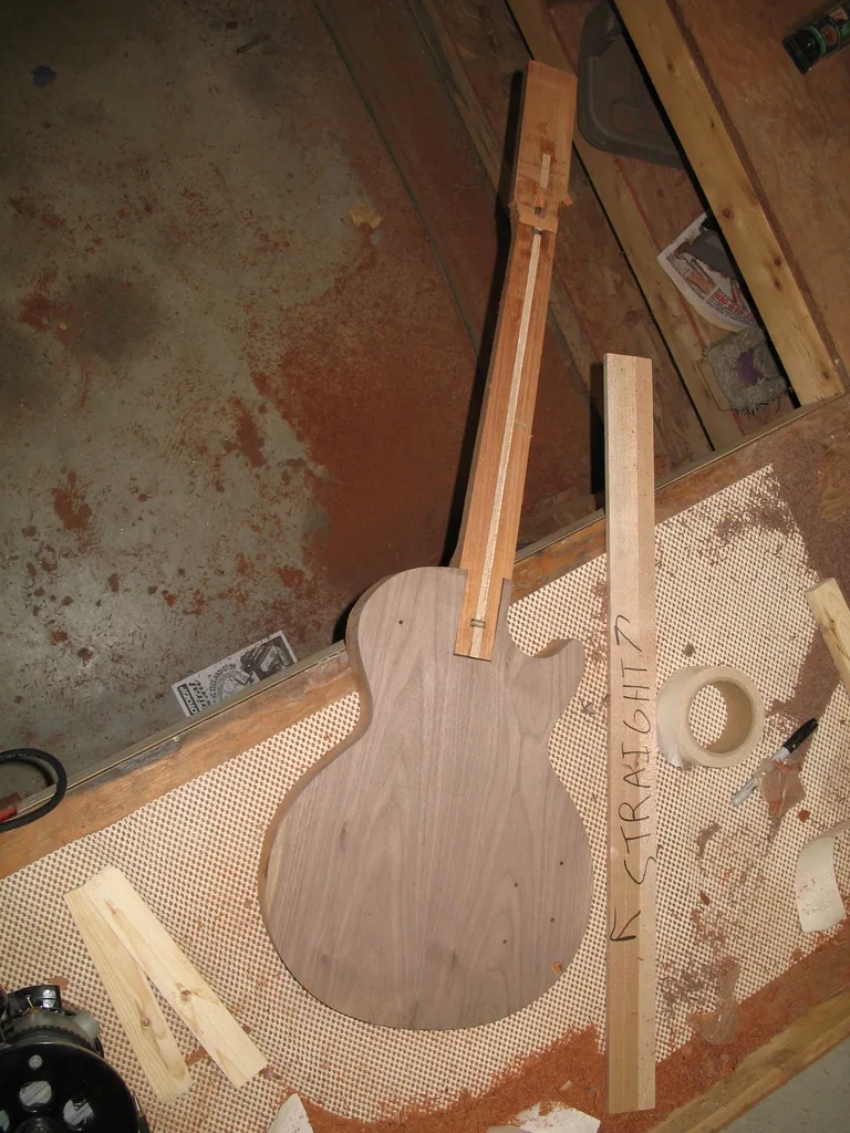 The guitar body rough-cut to the Les Paul outline