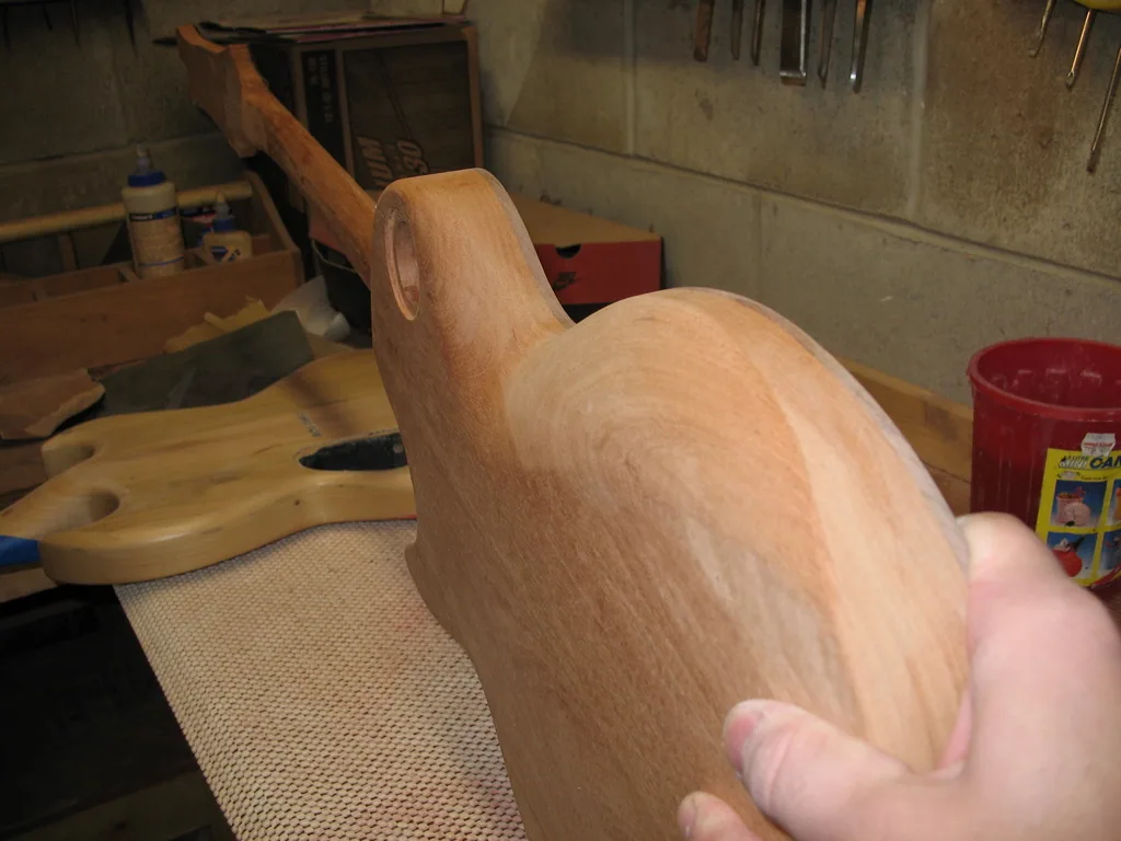 Hand-carving the soft contours with a rasp and file