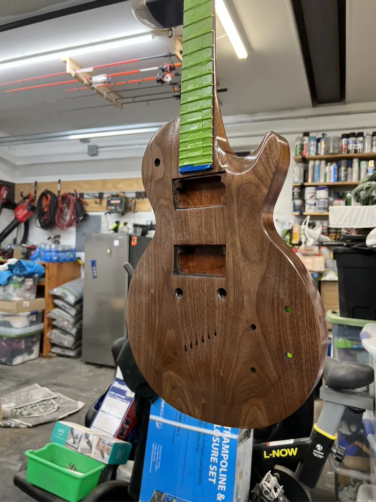 The sanded guitar in the shop, ready for hardware