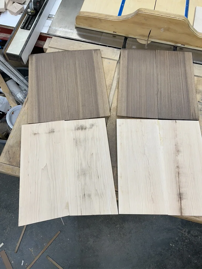 Light maple and dark walnut boards selected for the build
